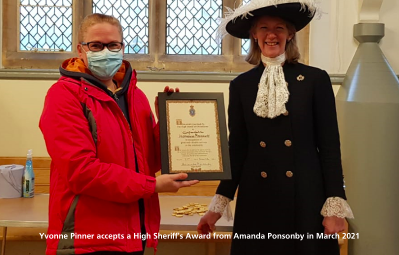 Yvonne Pinner accepts a High Sheriff's Award from Amanda Ponsonby in March 2021