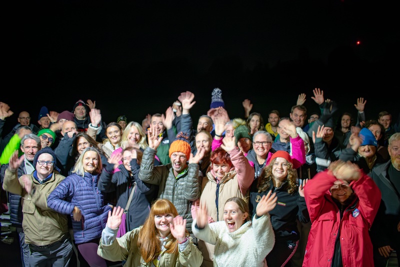 People celebrating at CEO Sleepout 2024 looking happy